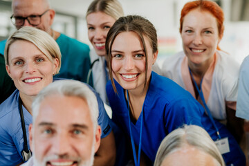 Portrait of happy doctors, nurses and other medical staff in hospital.