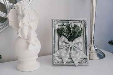 Christmas decor frames with Christmas tree branches and a bow