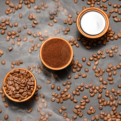 Three cups with different coffee, coffee beans, ground and ready-made drink.