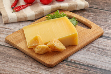 Parmesan hard cheese with small pieces