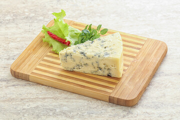 Blue cheese piece over board