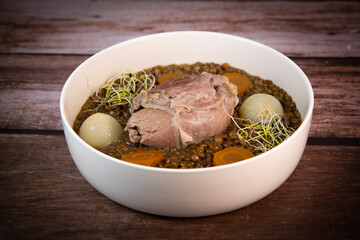 Recipe for salted pork shank with lentils. High quality photo
