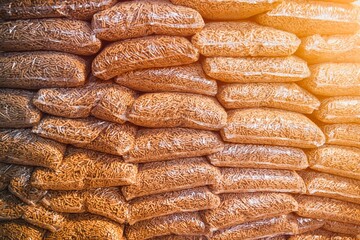 Close-up of stacked wood pellets. Detailed shot of woodpellets. Pellet texture