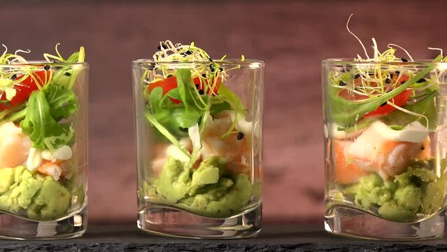 Avocado, shrimp, arugula, mayonaise, espelette pepper and lemon, leek sprouts recipe. High quality 4K video