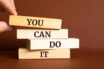 Wooden blocks with words 'You can do it'.