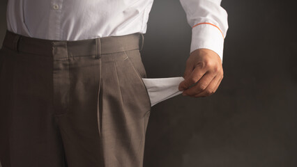 A business man with empty pants bag, financial crisis and poor income economy