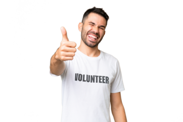 Young volunteer caucasian man over isolated chroma key background with thumbs up because something good has happened