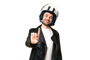 Young caucasian man with a motorcycle helmet over isolated chroma key background showing and lifting a finger