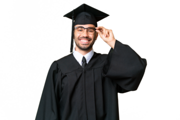 Young university graduate man over isolated chroma key background with glasses and happy