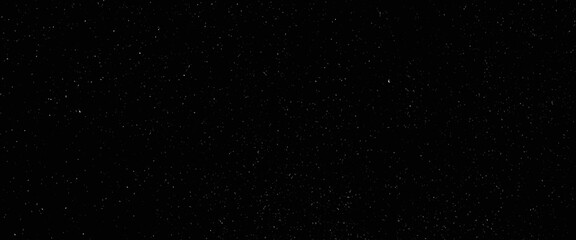 Abstract glitter background, snow imitation in silver, on black, white scratches isolated on a black background. template for design.	