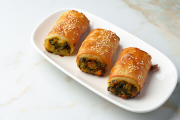 Banquet table with variety of stuffed pies pastry