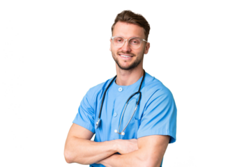 Young nurse man over isolated chroma key background with arms crossed and looking forward