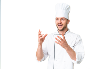 Young caucasian chef over isolated chroma key background with surprise facial expression