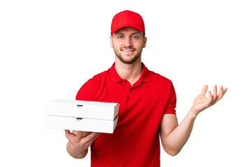 Pizza delivery man with work uniform picking up pizza boxes over isolated chroma key background...