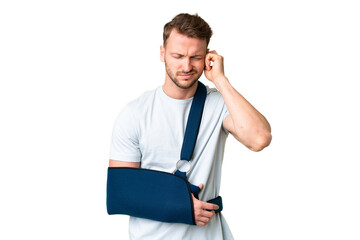 Young caucasian man with broken arm and wearing a sling over isolated chroma key background...