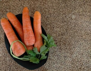 Carrots on a sack background table
