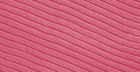Texture of smooth knitted sweater with pattern. Handmade knitting wool or cotton fabric texture. Background of Large knit pattern with knitting needle or crochet. Color Of The Year 2023 - Viva Magenta