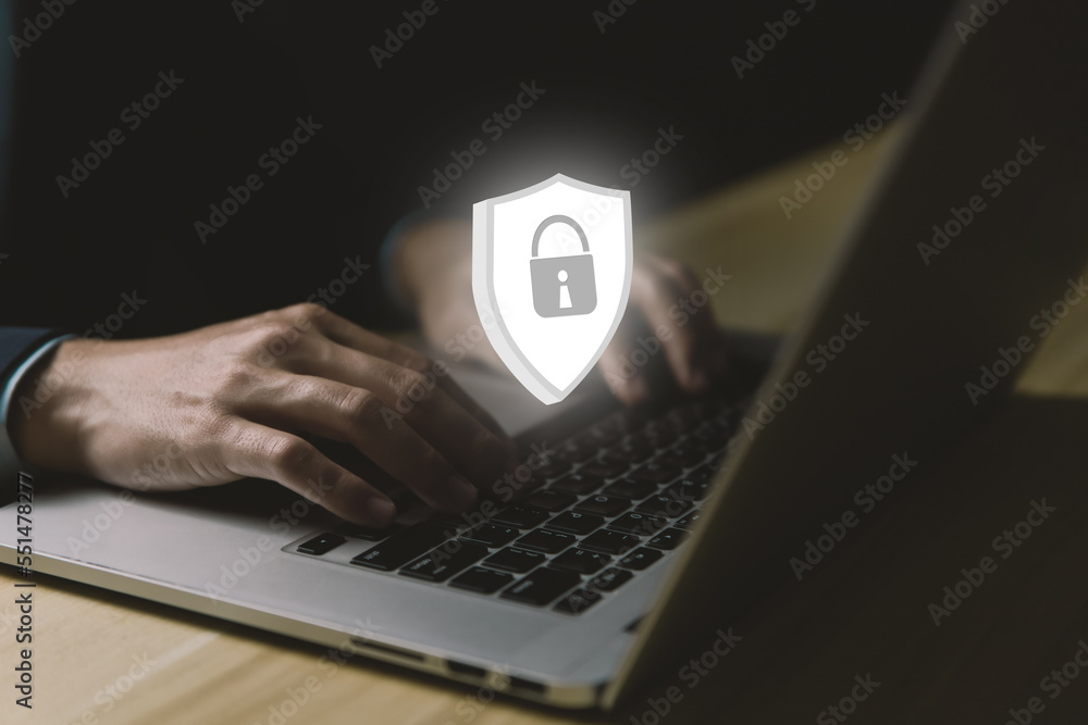 Poster businessman using a laptop with shield icon with lock sign. computer data password protection concep