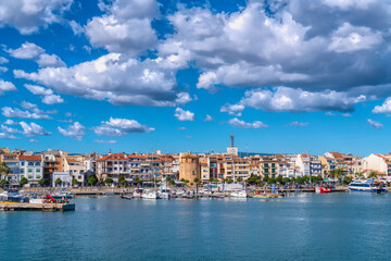 Cambrils seafront Spain boats and buildings in Tarragona Province Catalonia with blue Mediterranean...