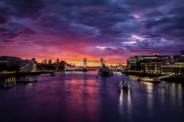 Colorful sunrise behind the famous Tower Bridge of London, England