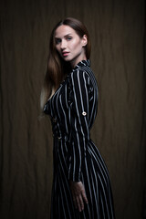 portrait of a young attractive woman on a dark background