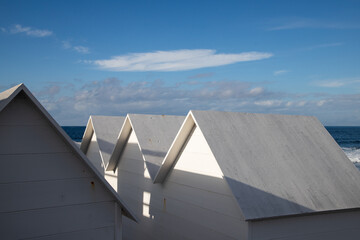 white  empty beach huts in Procida