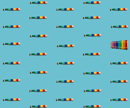 Pattern of colorful flutes with single xylophone