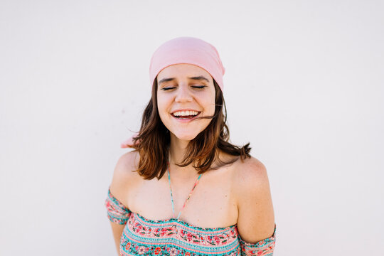Happy young woman wearing bandana
