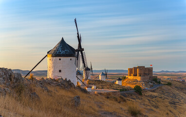 Consuegra windmills and castle long exposure at dusk