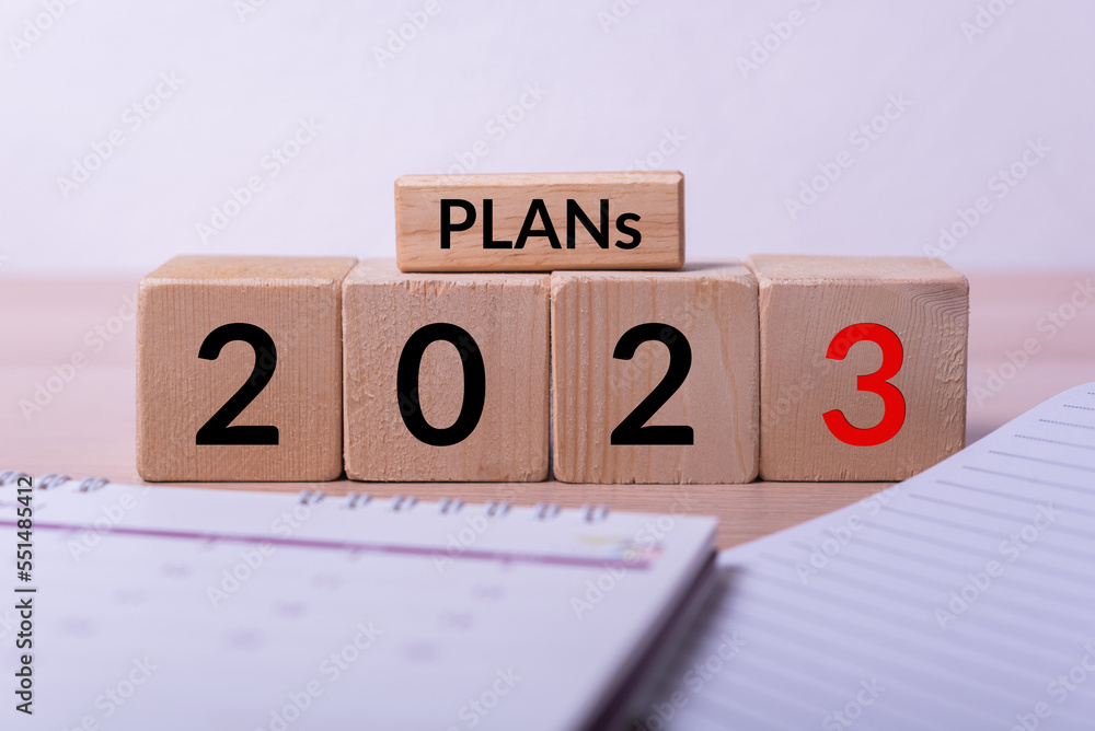 Aufkleber abstract wood cube building block with text plans 2023 on it