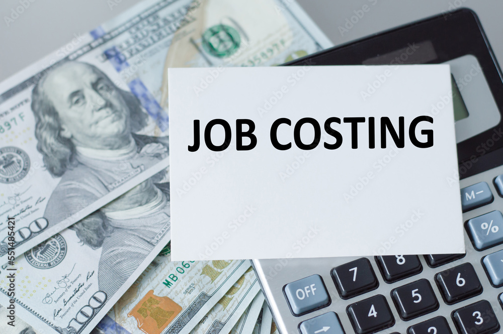 Poster business concept. text job costing on a card on the background of the calculator on the table next t