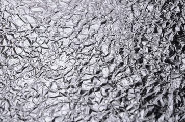 Silver metallic crumpled aluminum foil background