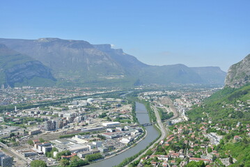 View of the city Grenoble in France with mountains in the background and river on a nice sunny day 