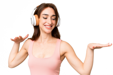 Young caucasian woman over isolated chroma key background listening music and dancing