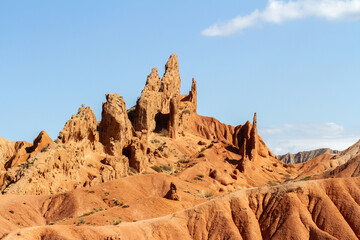 Fototapeta premium Fairytale canyon or Skazka Canyon, Natural park of colorful rocks near Issyk-Kul lake, Kyrgyzstan.