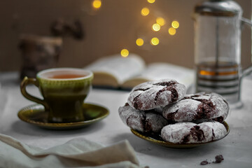 Tea party with black and white American cookies chocolate crackers for Christmas.