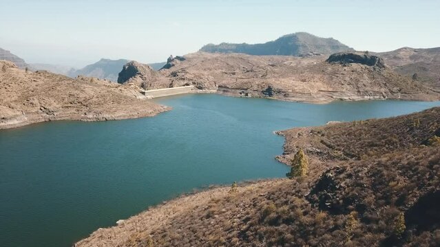 aerial shot in close-up to the water dam known as Las Ni&ntilde;as in the municipality of Tejeda. On a sunny day on the island of Gran Canaria.