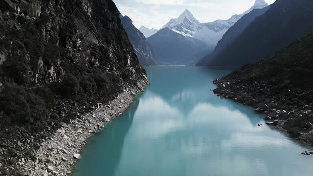 Lake Paron, Pyramid Mountain, Aerial Drone Above Water Andean Cordillera in Peru Huascaran National Park, Peruvian Hiking Destination