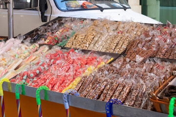 Candies, nuts and caramelised dried fruit at a street market