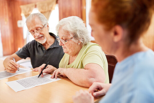 Pair of seniors solving puzzles as brain jogging