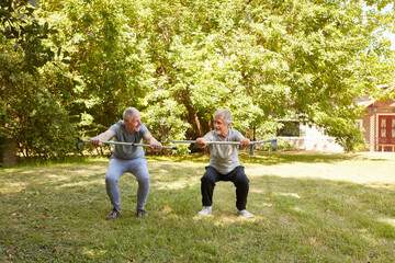 Seniors with canes do squats for fun