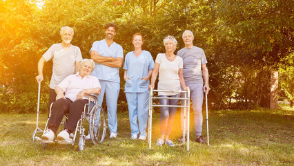 Group of seniors with people in wheelchairs and with walkers