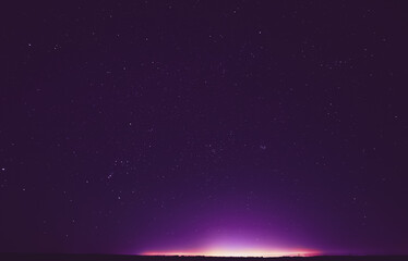 Obraz premium Colourful Night Starry Sky In Violet Colors. Soft Magenta-pink Colours. Bright Night Starry Sky. Dream View. Amazing Night View Sky. Bright Purple, Yellow, Pink Colors.