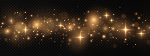 Golden sparks and glitter special light effect. Shining bokeh is isolated on a transparent background.