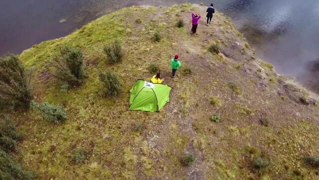 Campers Coming Out From The Tent Near The Lake In Huaraz, Peru. Aerial Drone Shot