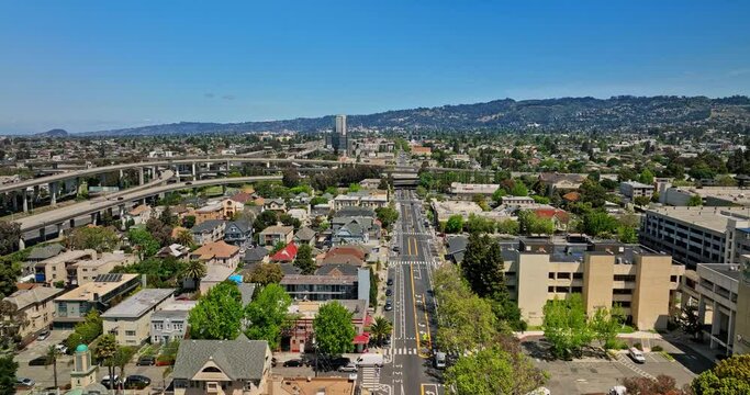 Oakland California Aerial v10 flyover across pill hill and mosswood neighborhoods, flying straight above telegraph avenue capturing complex interstate highways - Shot with Mavic 3 Cine - April 2022