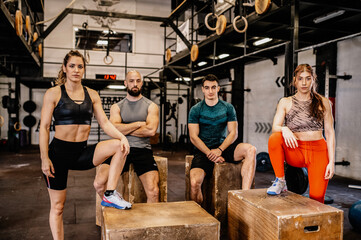 Group of people after training. Sports people resting and looking at the camera.