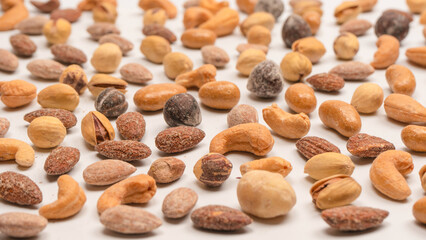  A group of almonds, pistachios, walnuts, macadamia, cashews.