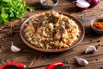 pilaf with meat and vegetables on a plate traditional asian food