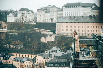 Girl looking at the panorama over the beautiful city of Luxembourg in Europe